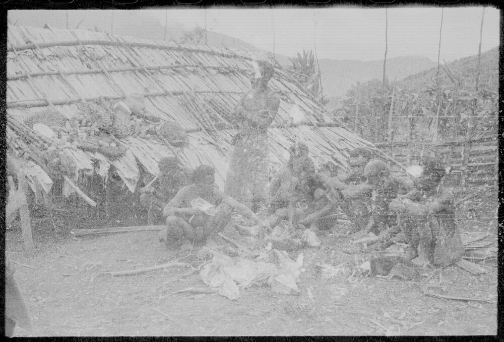 Group Sitting Outside a Building