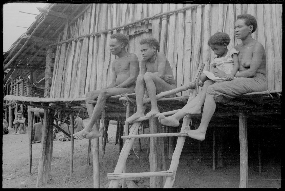 Group Sitting Outside a Building