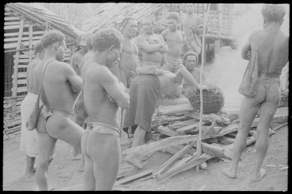 Placing Pandanus Nut on Fire