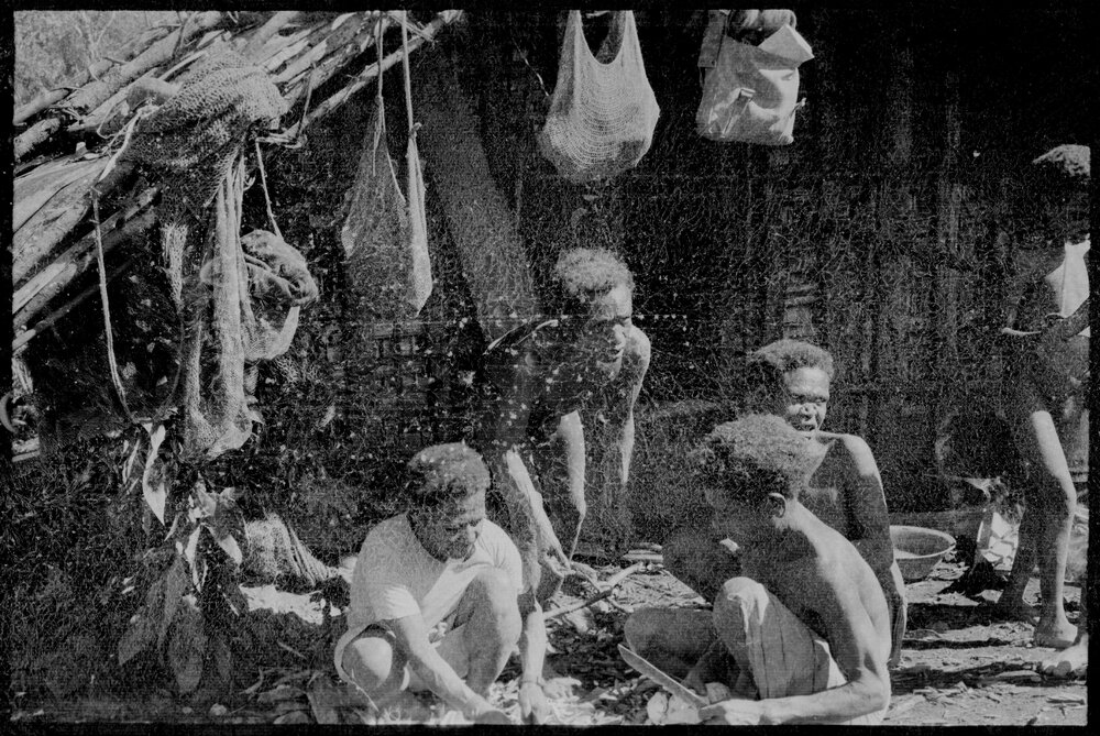 Group Sitting Outside a Building