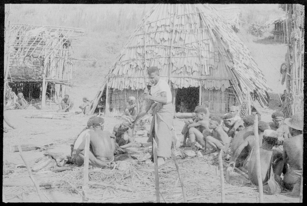 Group Gathered Outside Buildings