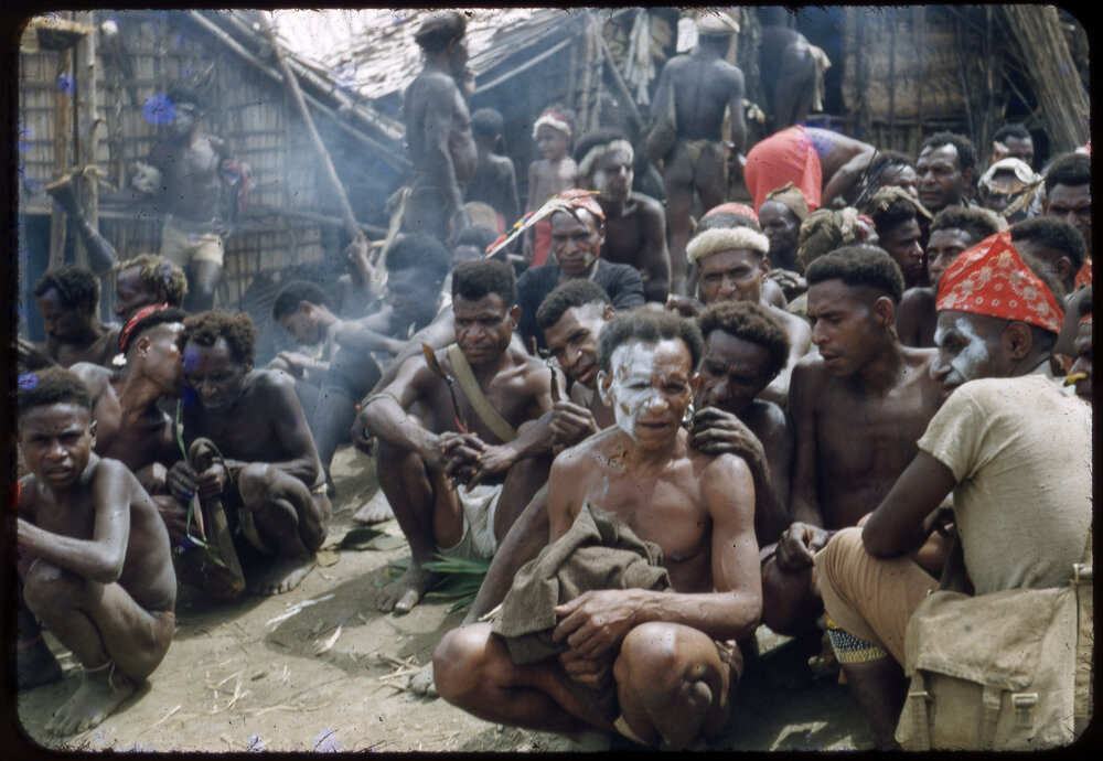 Men Sitting Outside a Building