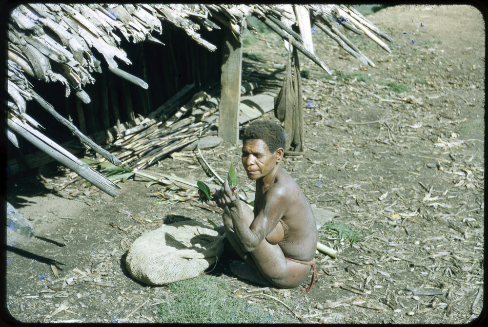 Woman Sitting Outside a Building