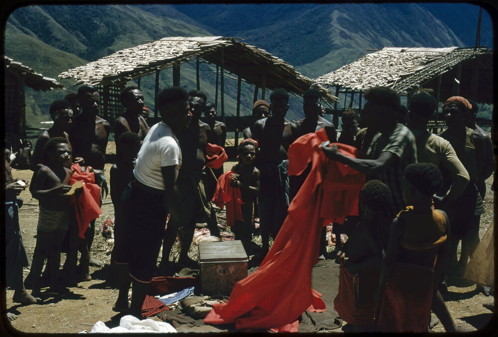 Group Unpacking Red Cloth