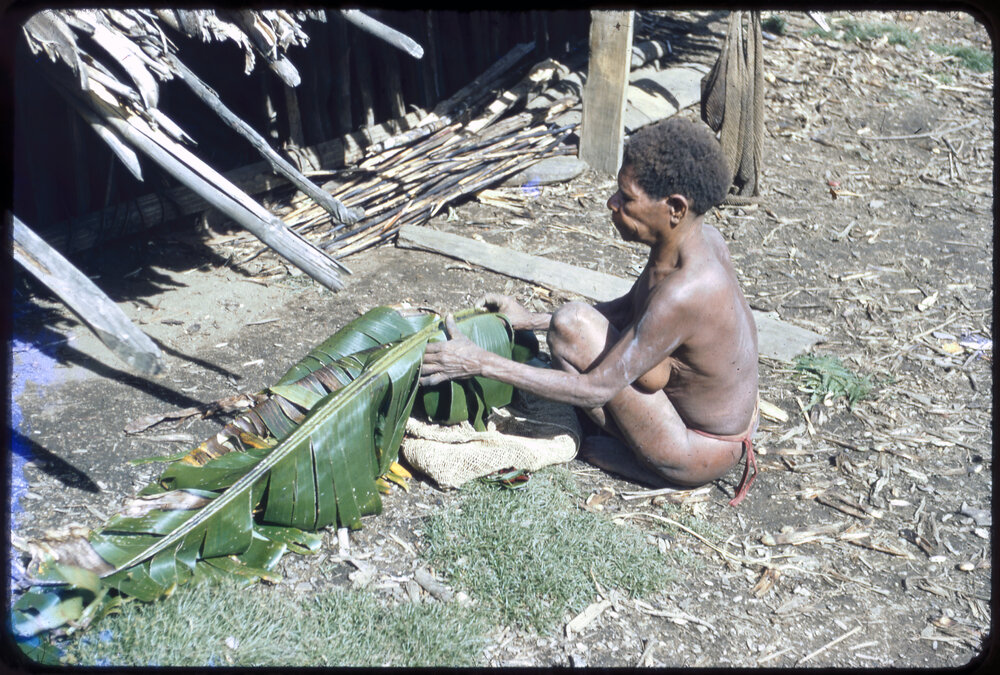 Woman Sitting Outside a Building