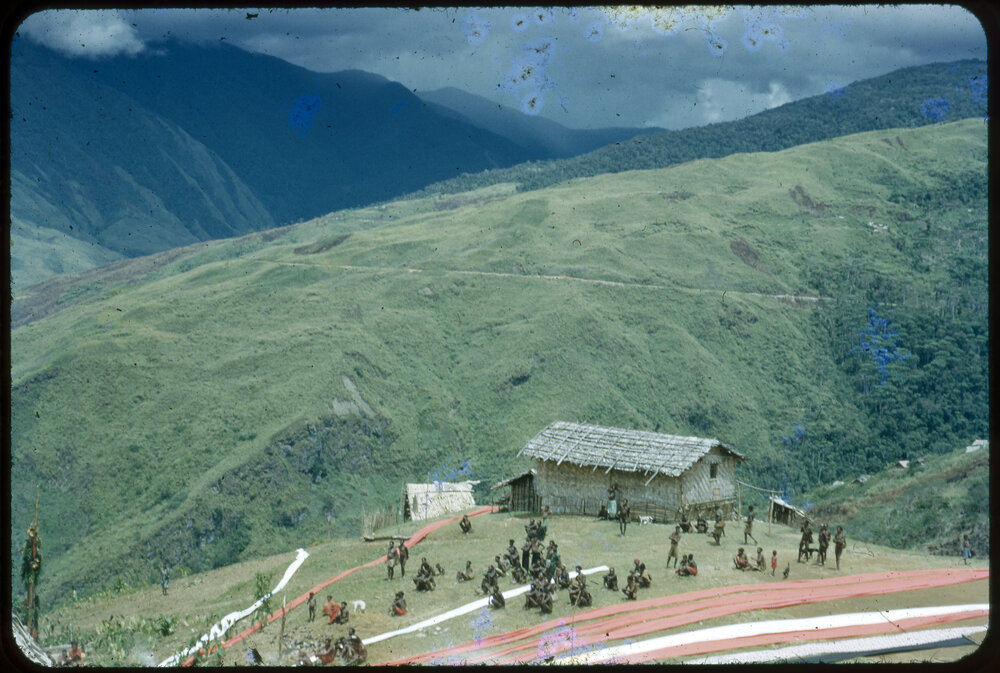 Village on Mountainside with Lengths of Cloth