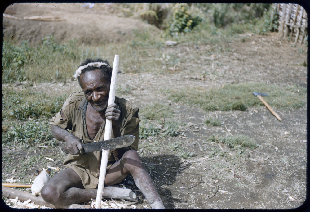 Man Carving Stick