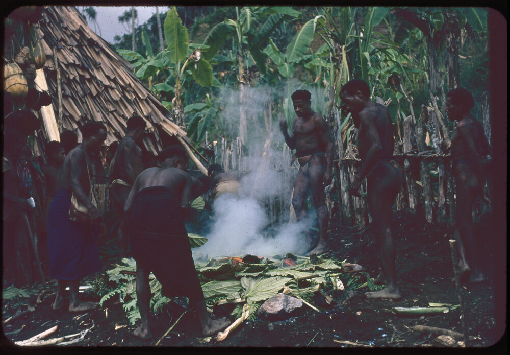 Group of Men Building a Fire