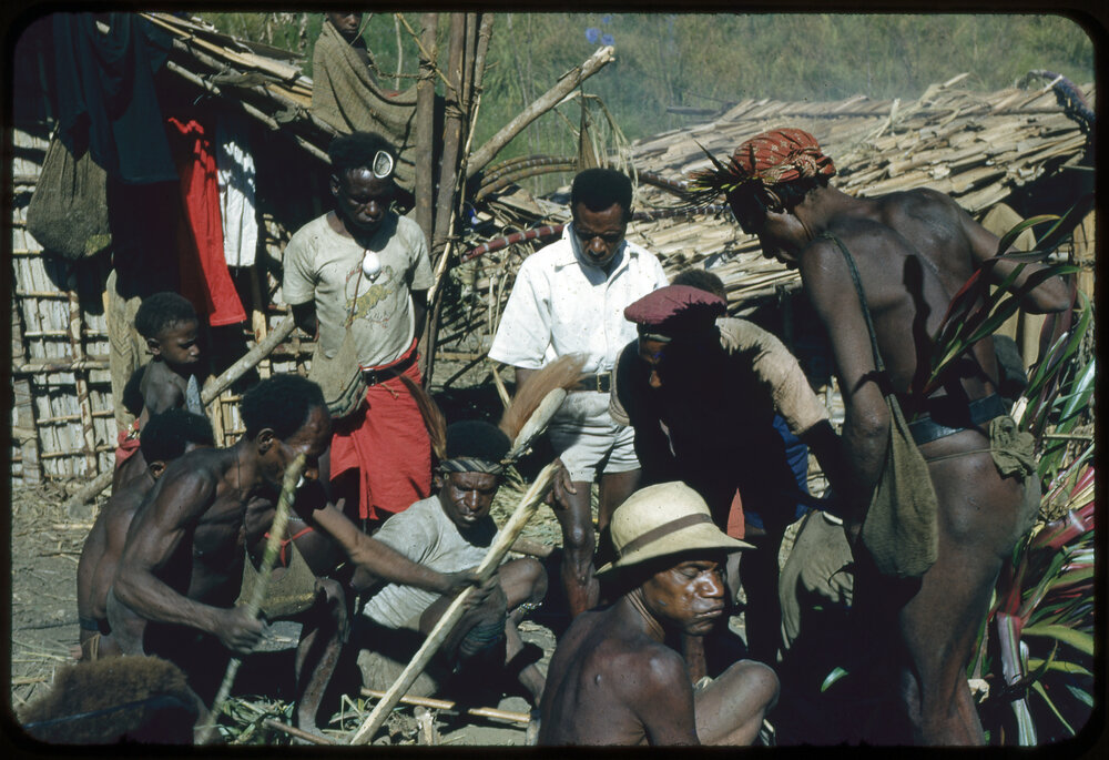 Men Preparing for a Ceremony