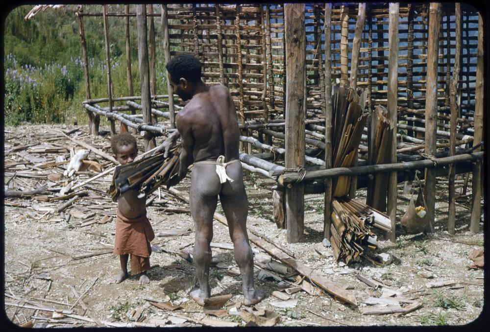 Man and Child Constructing a Building