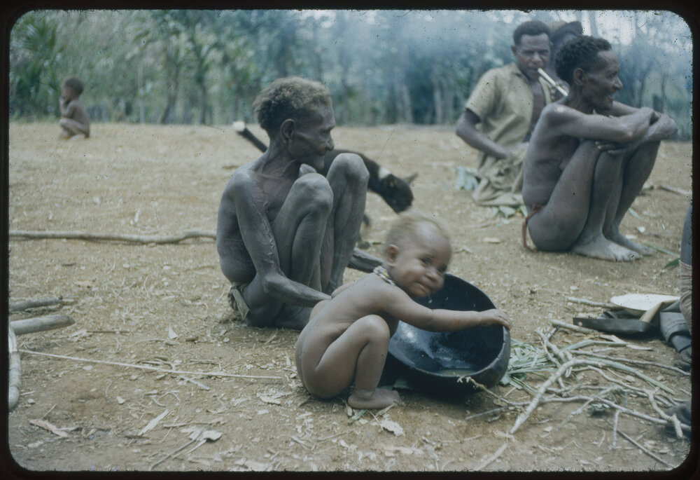 Men and Women Sitting with Baby