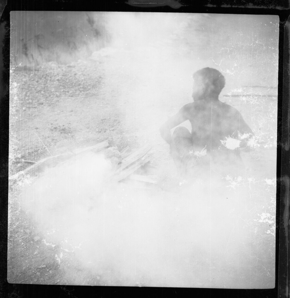 Man Sitting Beside Fire