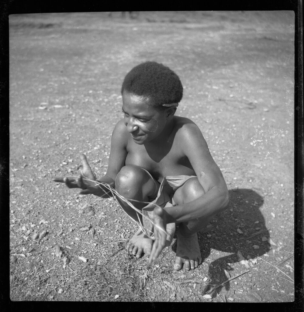 Girl Playing with String