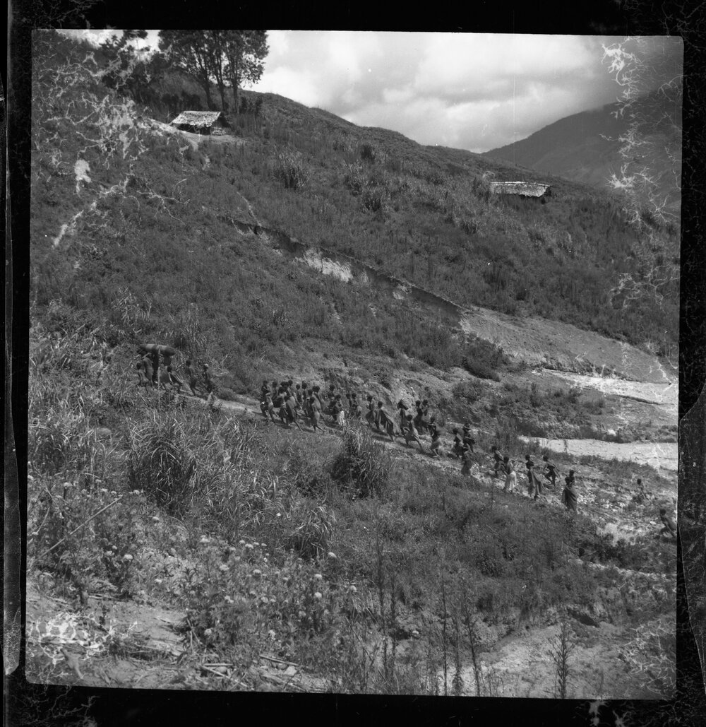 Group Walking Along Mountainside