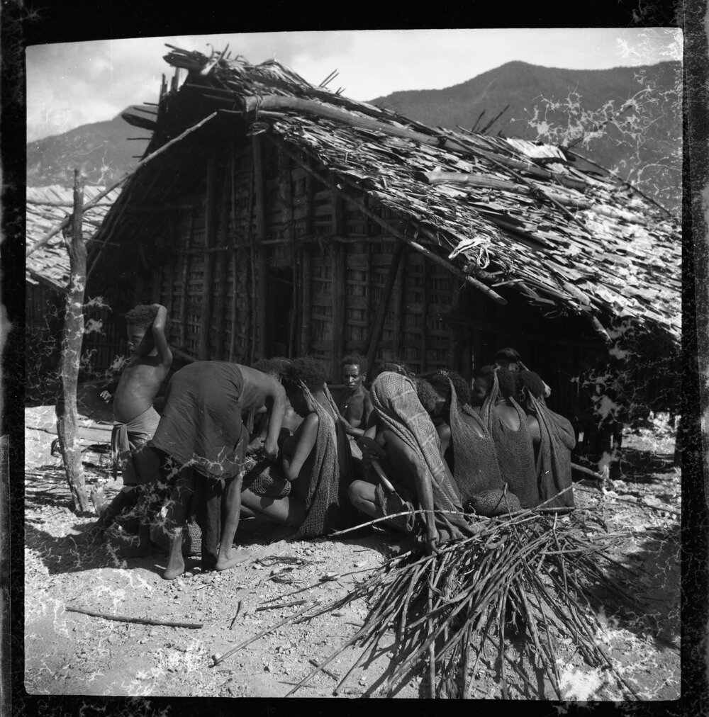 Group Sitting Outside a Building