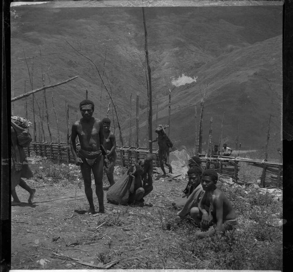 Group Passing Through Gate on Mountainside