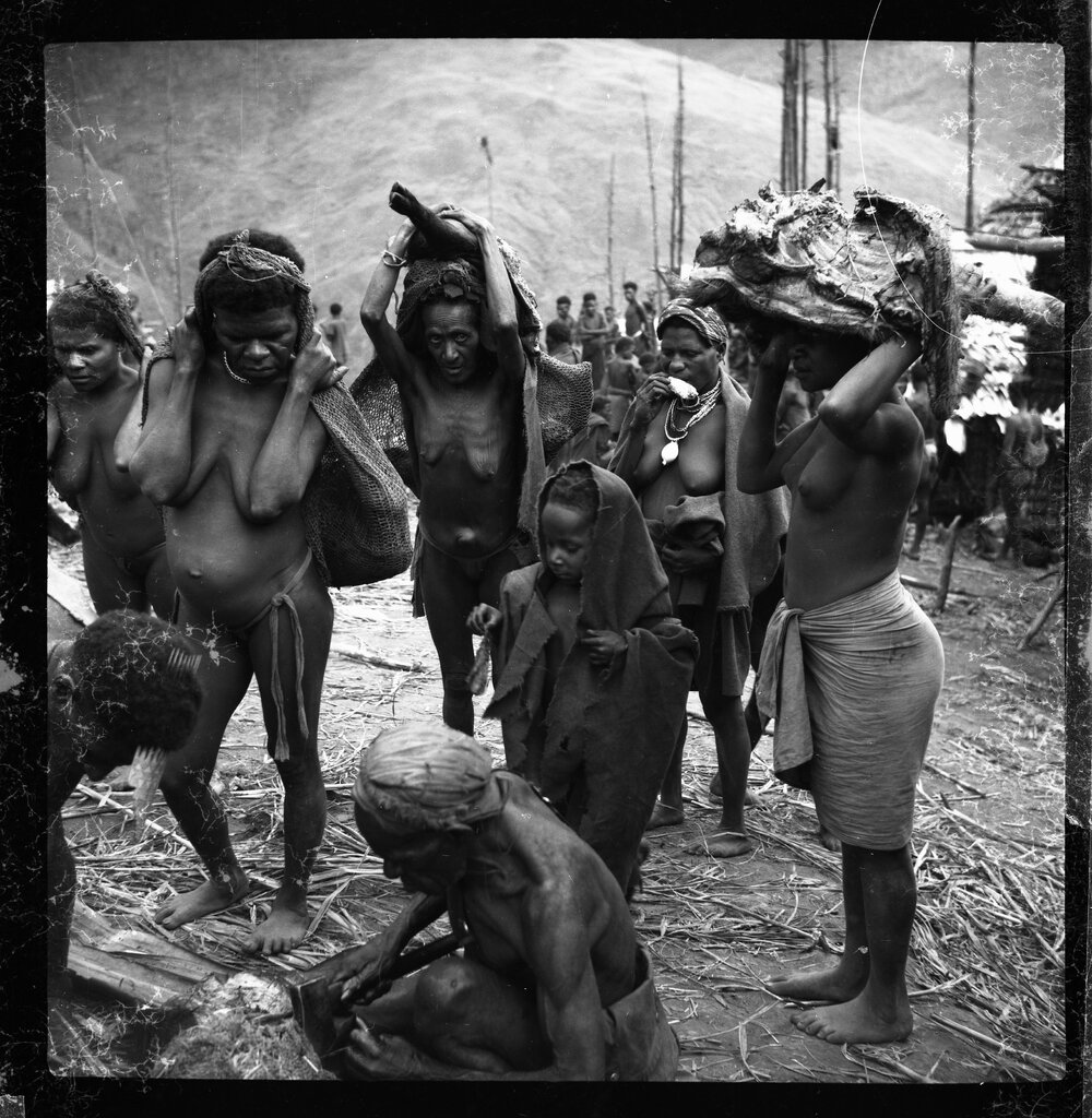 Group Carrying Pork and Net Bags