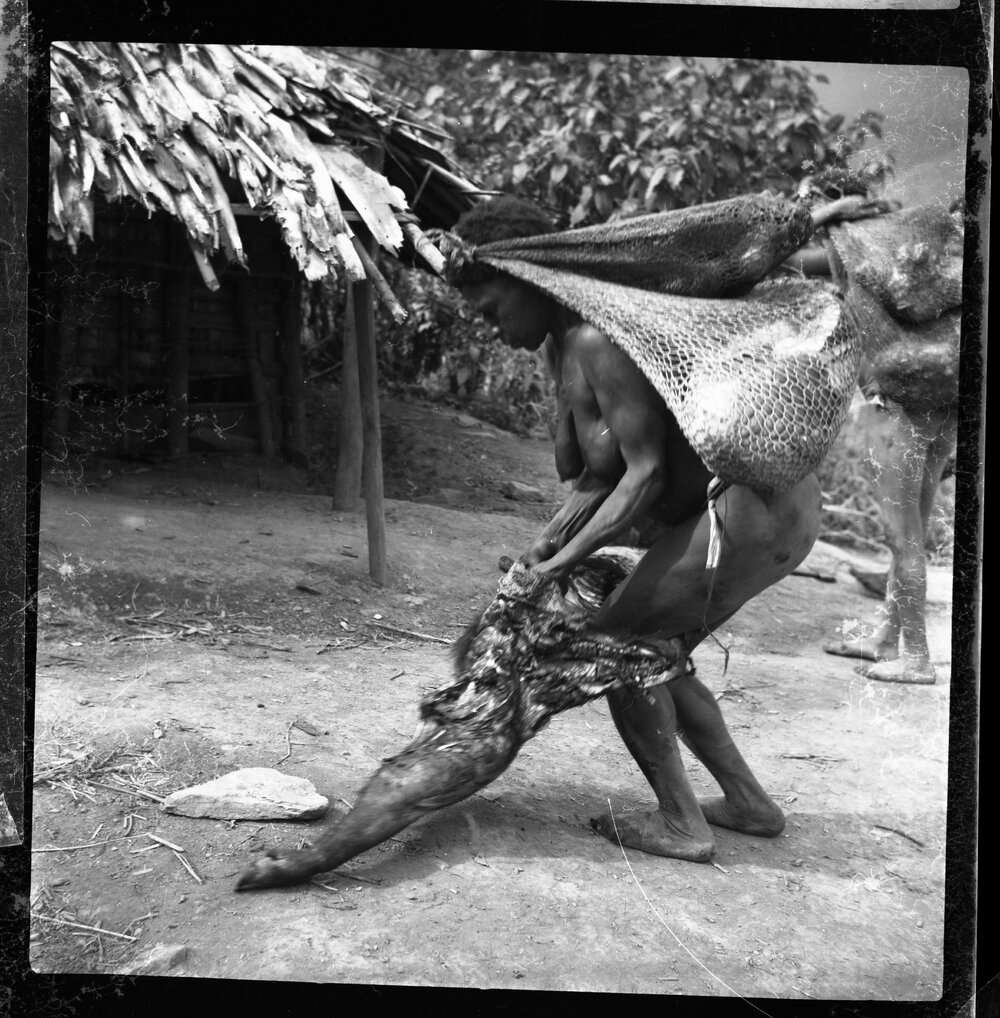 Woman Carrying Net Bags and Pork