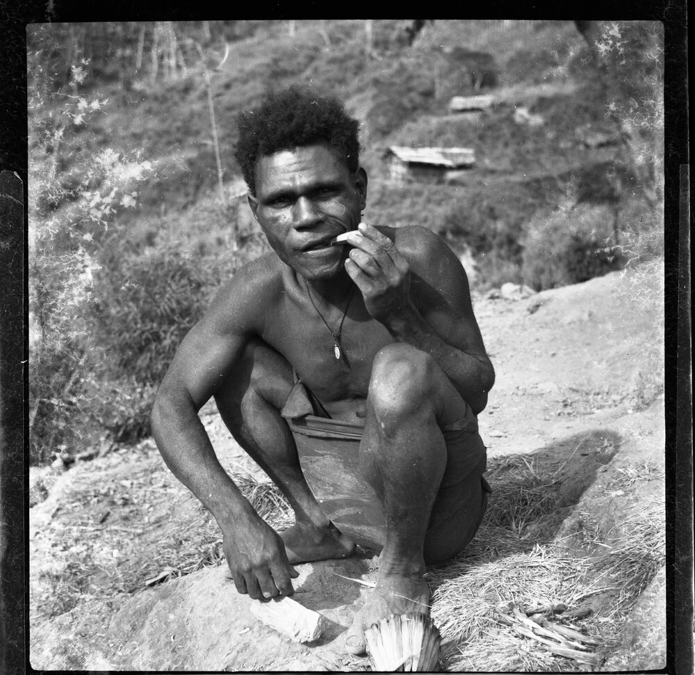 Man Sitting on Mountainside