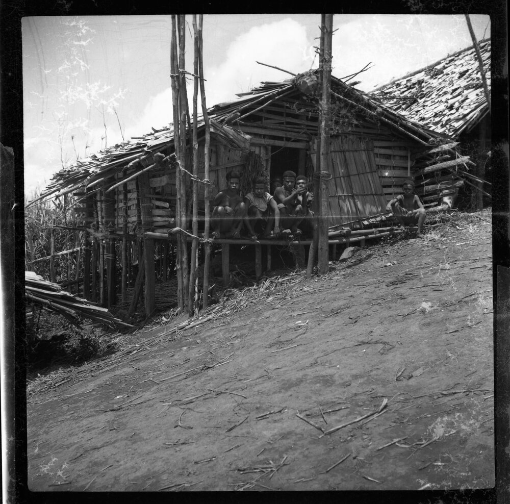 Group Sitting on Building Porch
