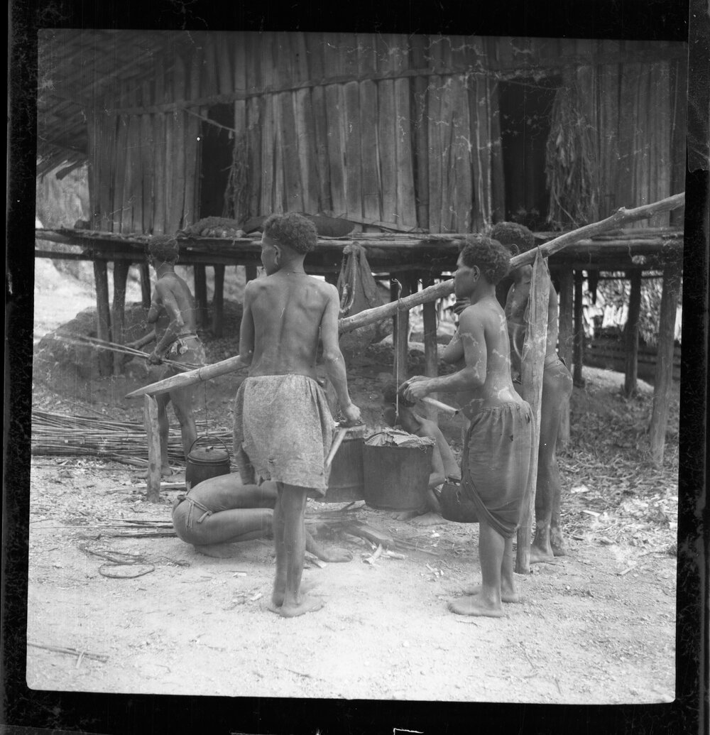 Women Beside Cooking Pots