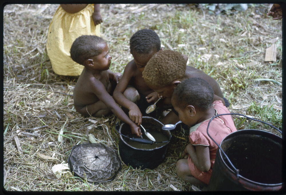 Children Eating from Pot