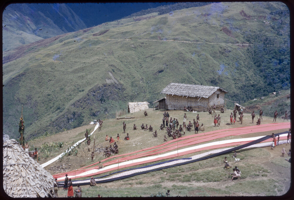 Lengths of Cloth Running Through Mountainside Village