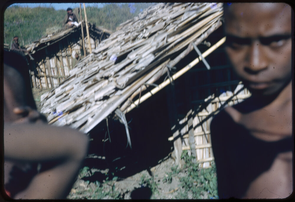 Child Standing Outside a Building