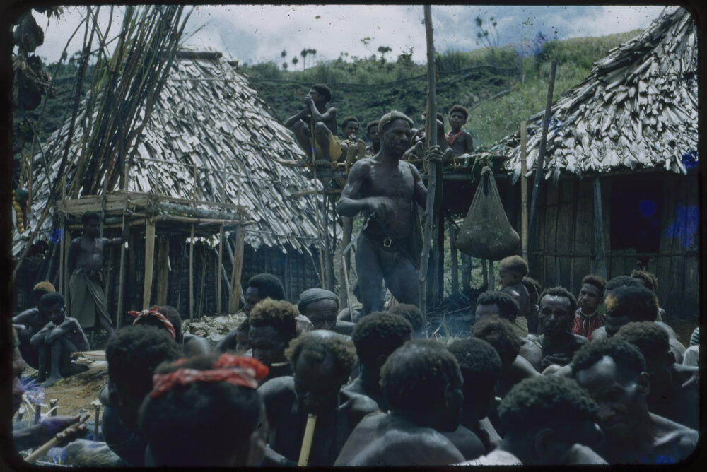 Group Gathered Outside Buildings