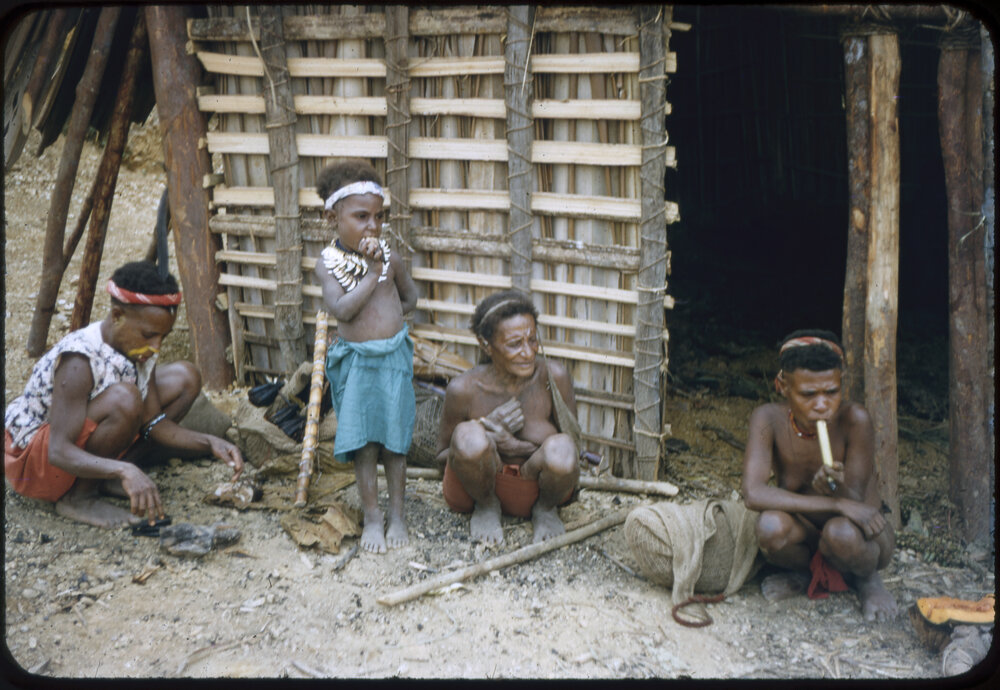 Women and Children Outside a Building