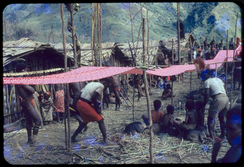 Red Cloth Suspended Through Village