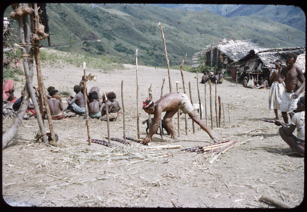 Man Preparing Food Distribution Piles