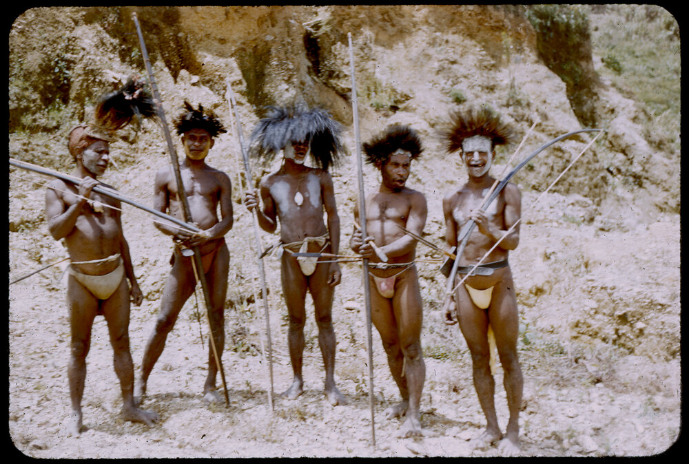 Men Standing with Bows