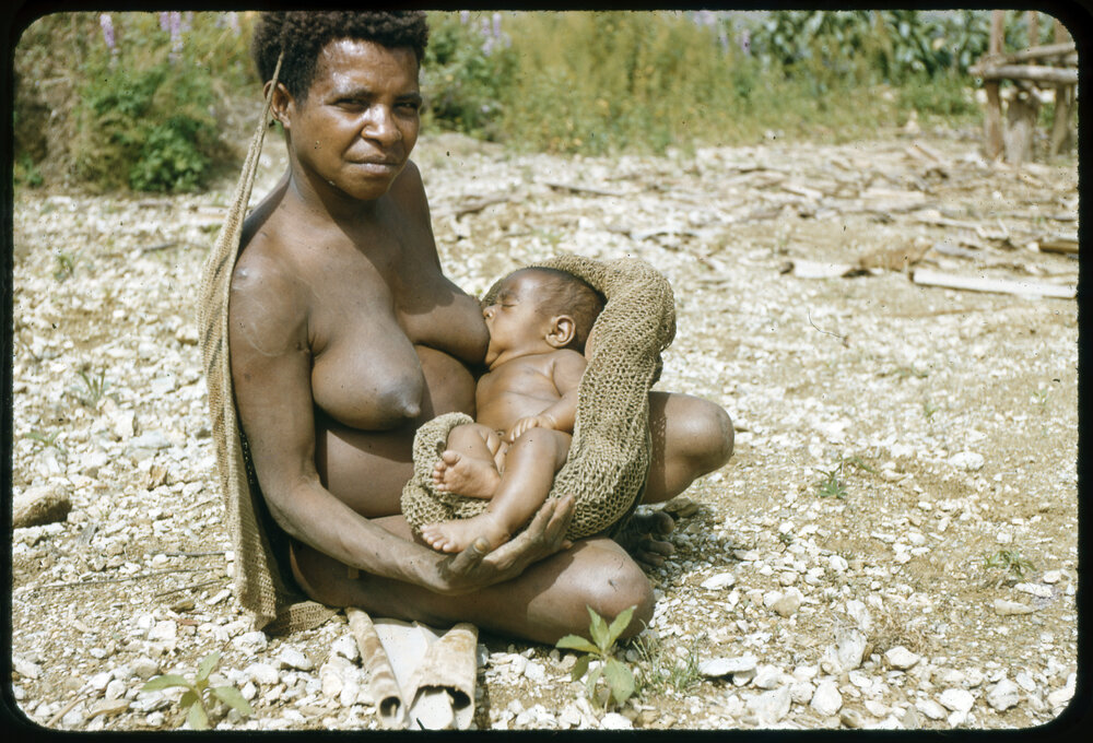 Woman Breastfeeding Child