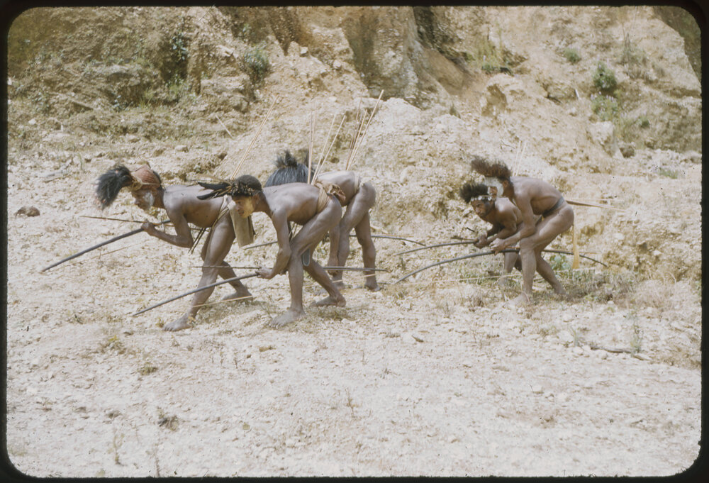 Men Posing with Bows