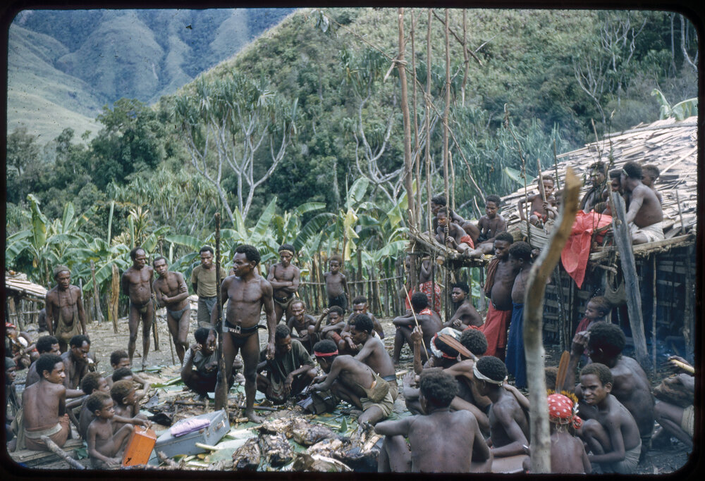 Group Gathered Outside Buildings