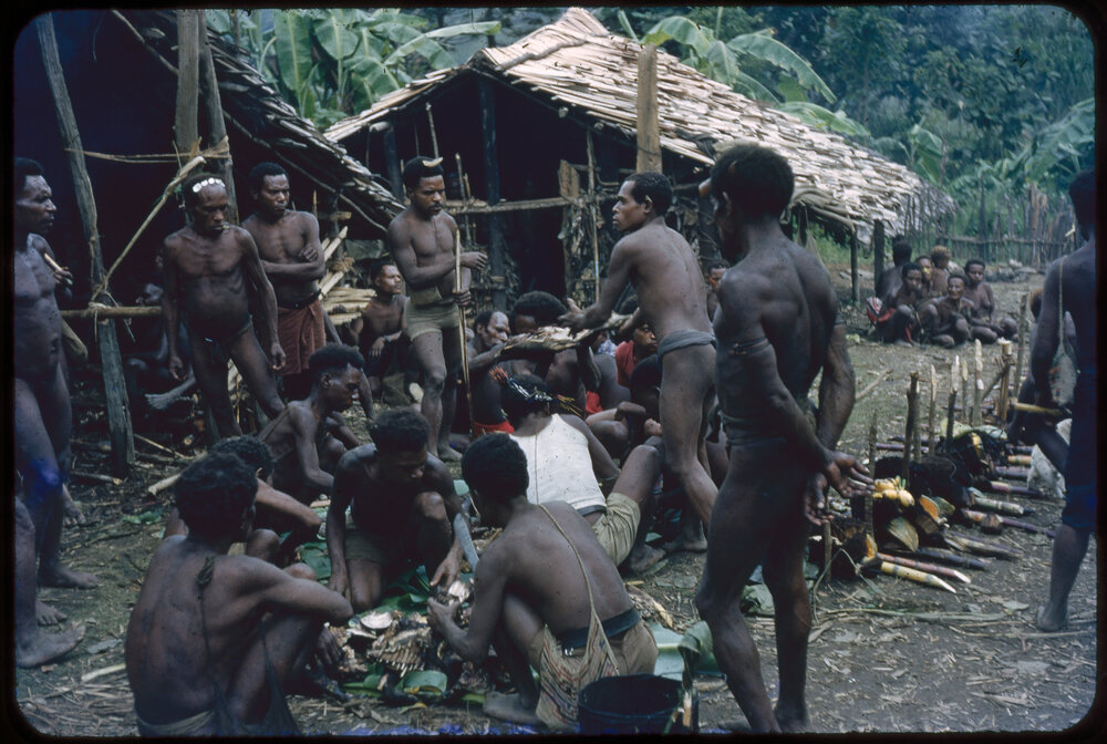 Group of Men Distributing Food