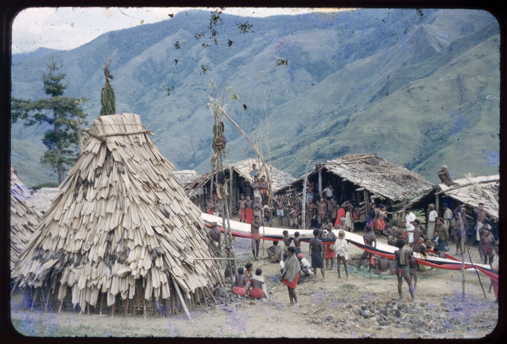 Groups Gathered in Village, with Lengths of Cloth