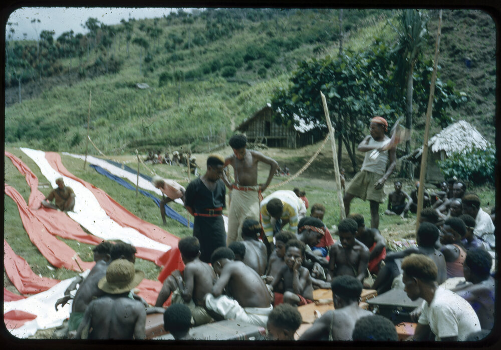 Group Gathered with Lengths of Cloth
