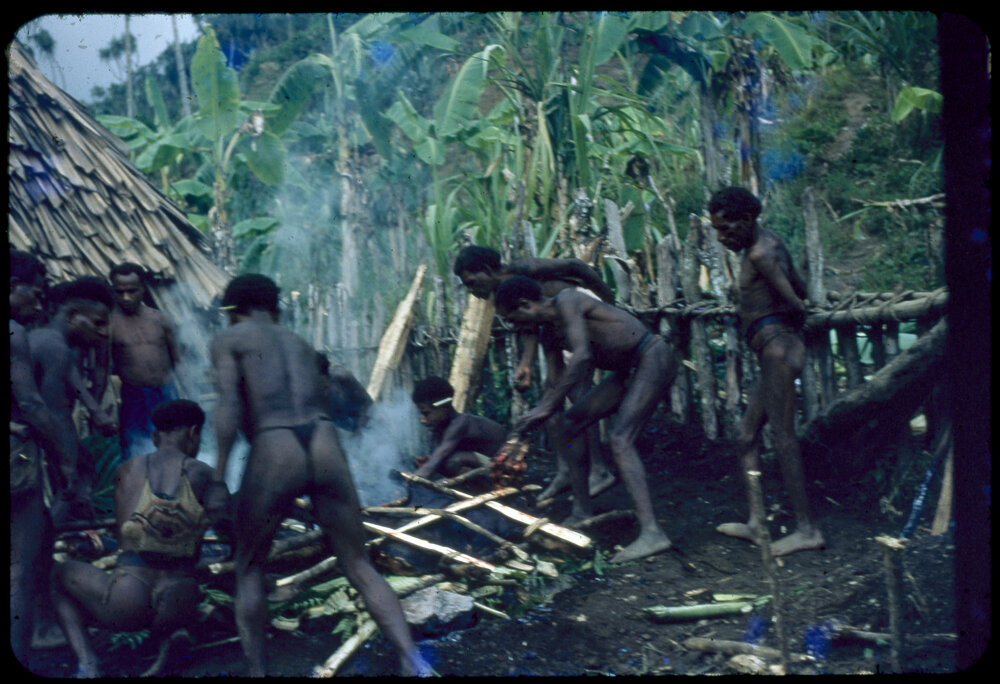 Group Cooking a Pig