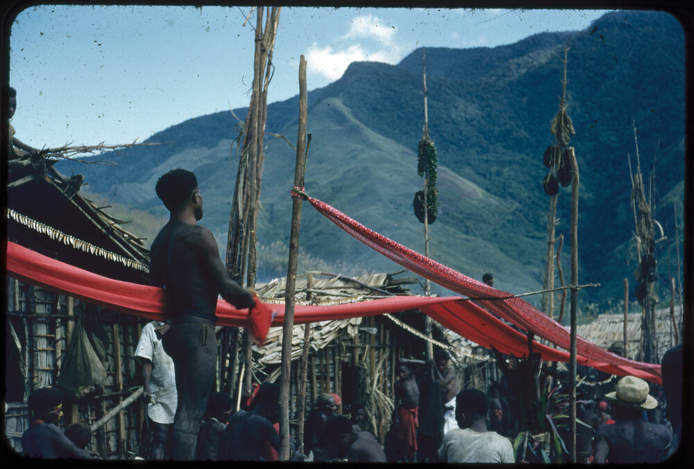 Red Cloth Suspended Through Village