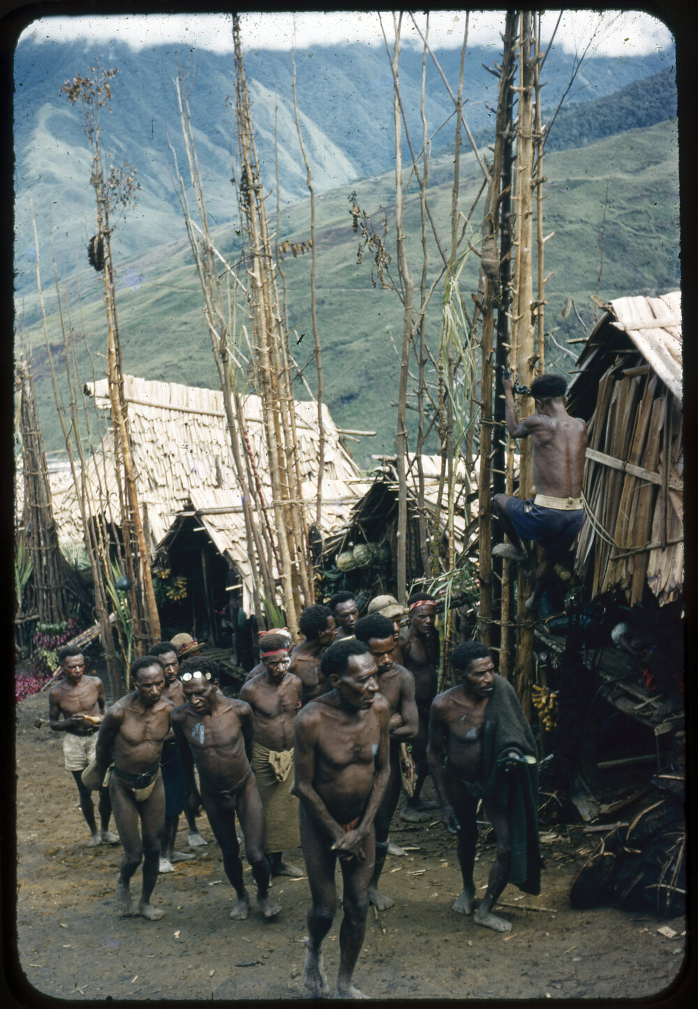 Group of Men Walking Through a Village