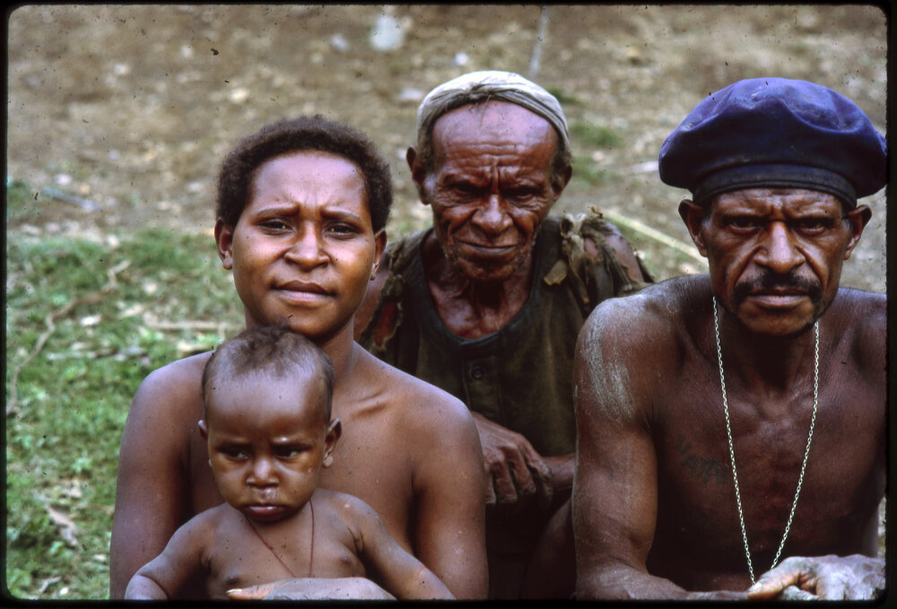 Woman, Child and Two Men
