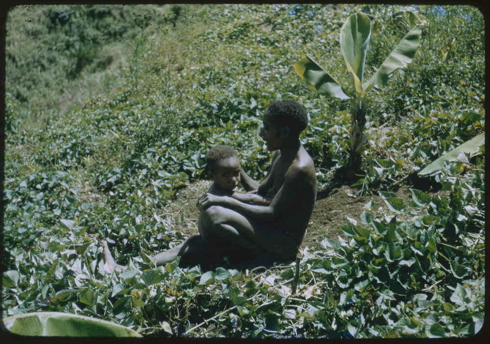 Woman Sitting with a Child