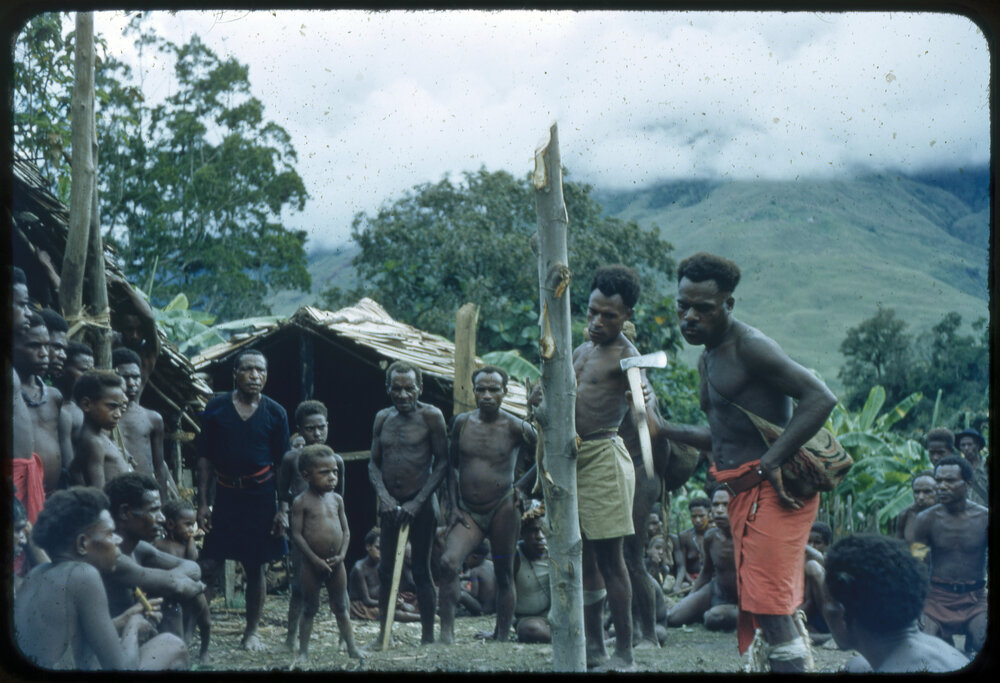 Group Gathered Around Pole