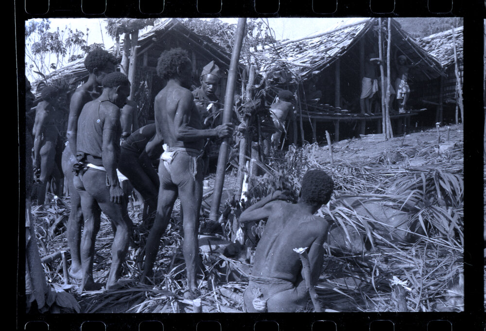Men Preparing for a Ceremony