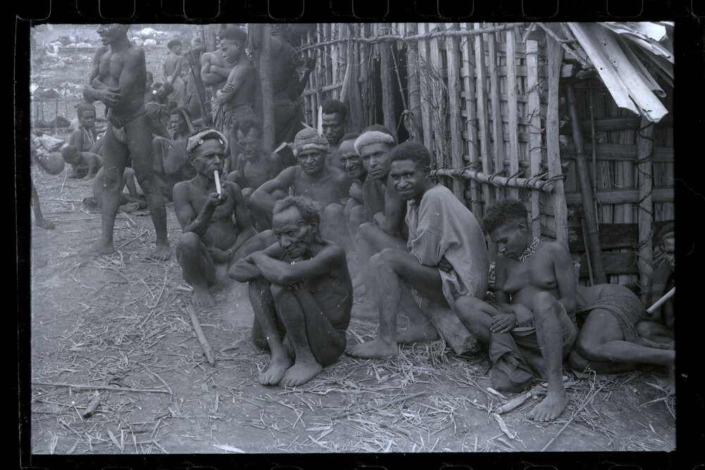 Group Sitting Outside a Building