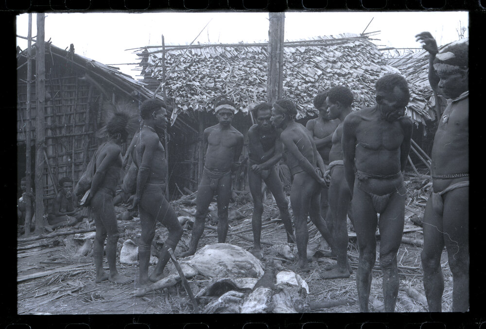 Group Gathered Outside Buildings