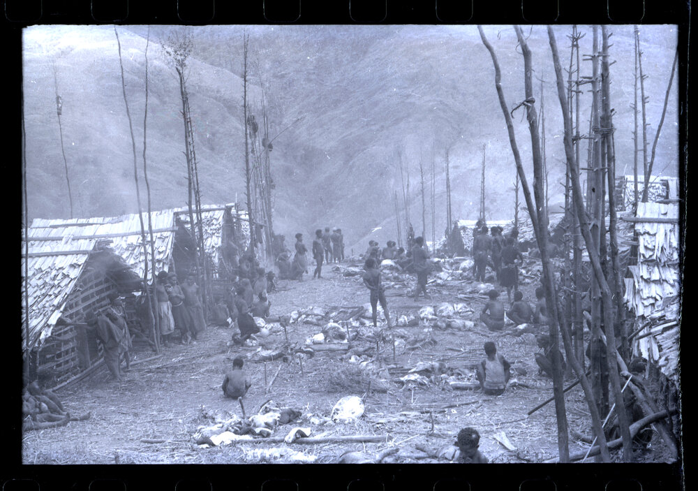 Groups of People Gathered Throughout a Village