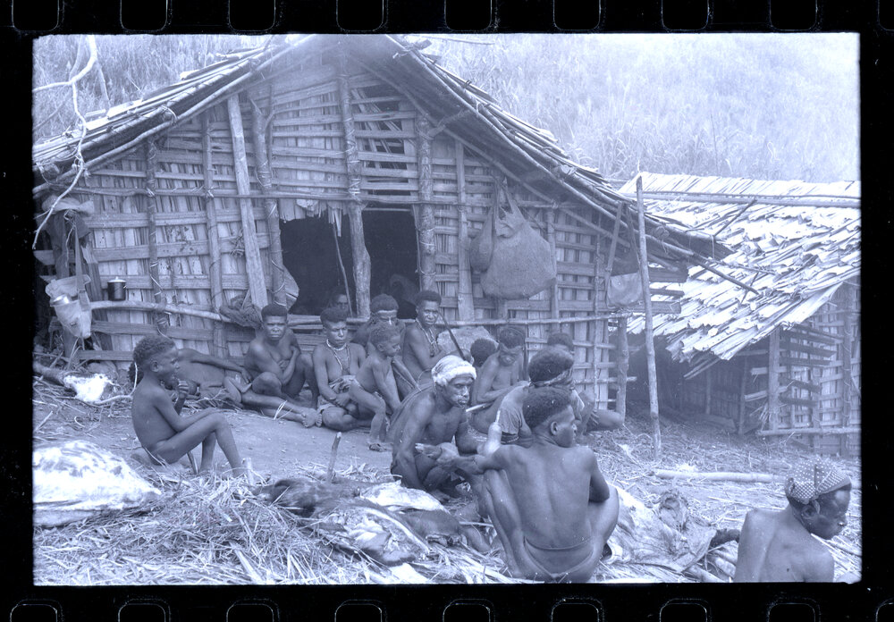 Group Sitting Outside a Building